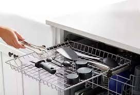 Third rack drawer holding kitchen utensils